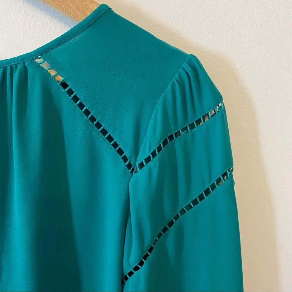 Ann Taylor Loft green jewel toned blouse with cut out detail size S.